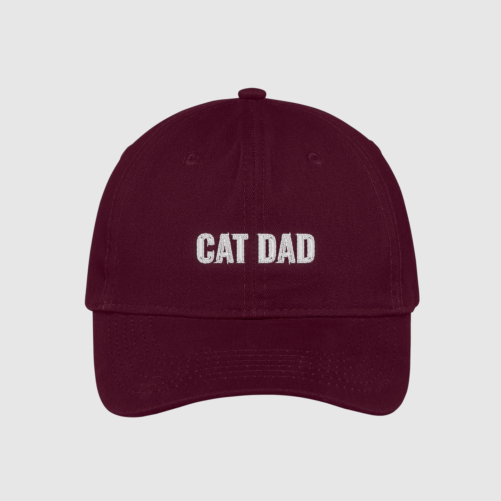 Maroon cat dad hat embroidered with white text