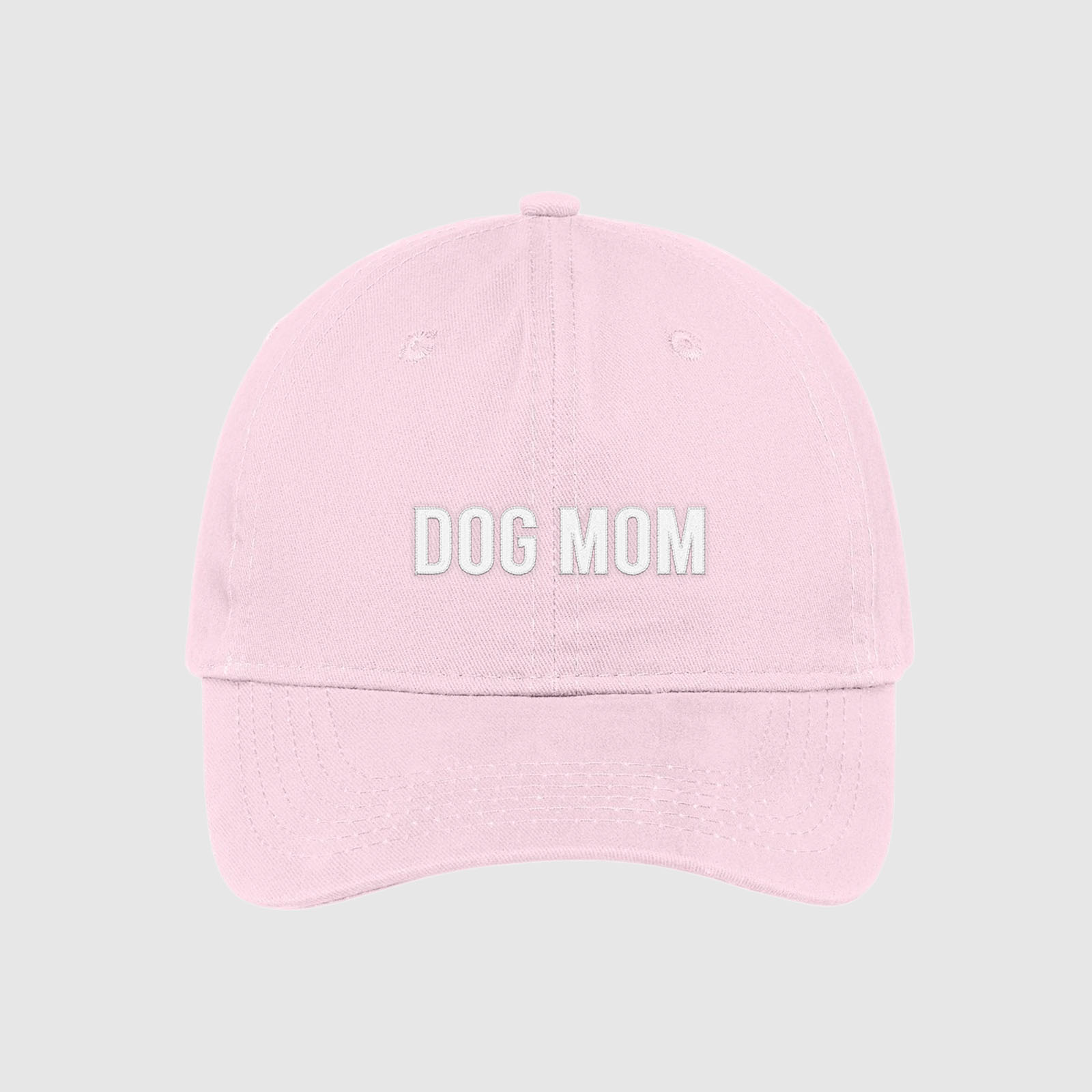 Blush pink Dog Mom Hat embroidered with white text.