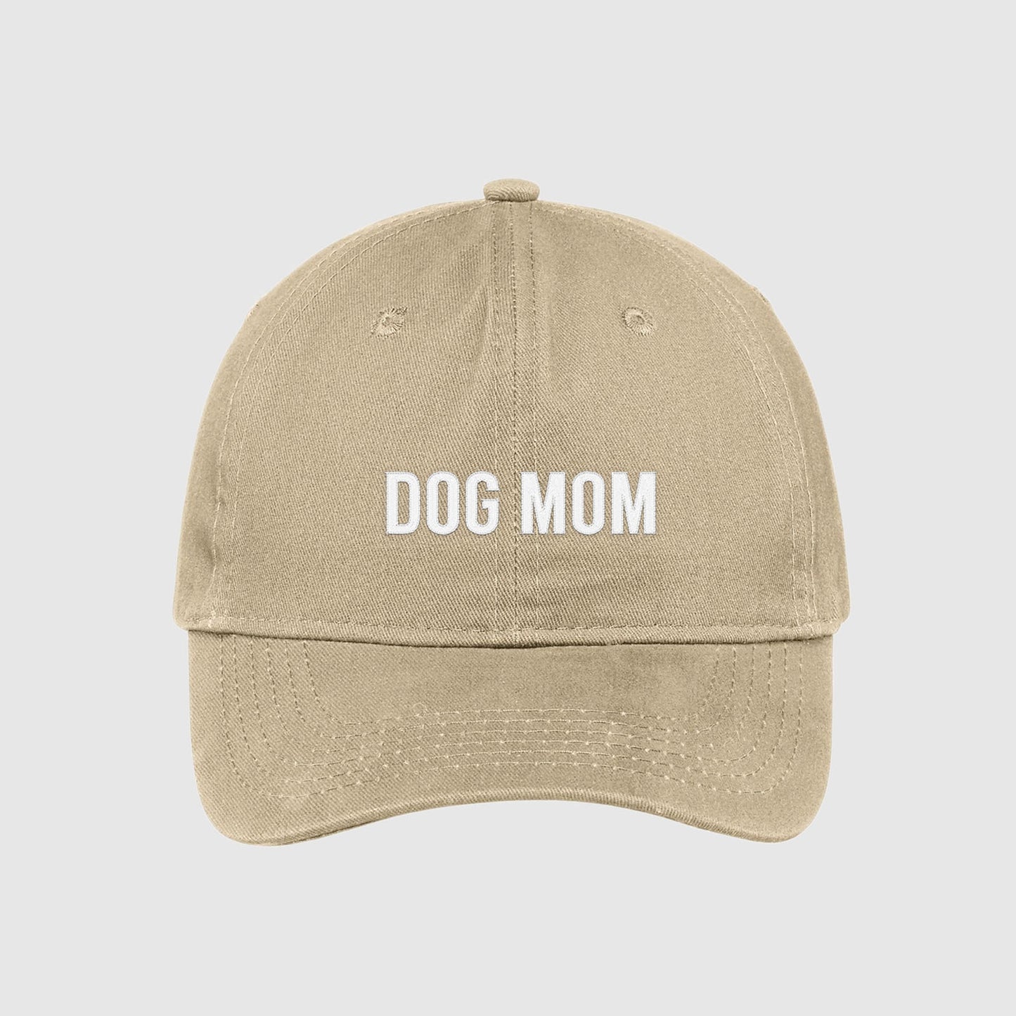 Tan Dog Mom Hat embroidered with white text.