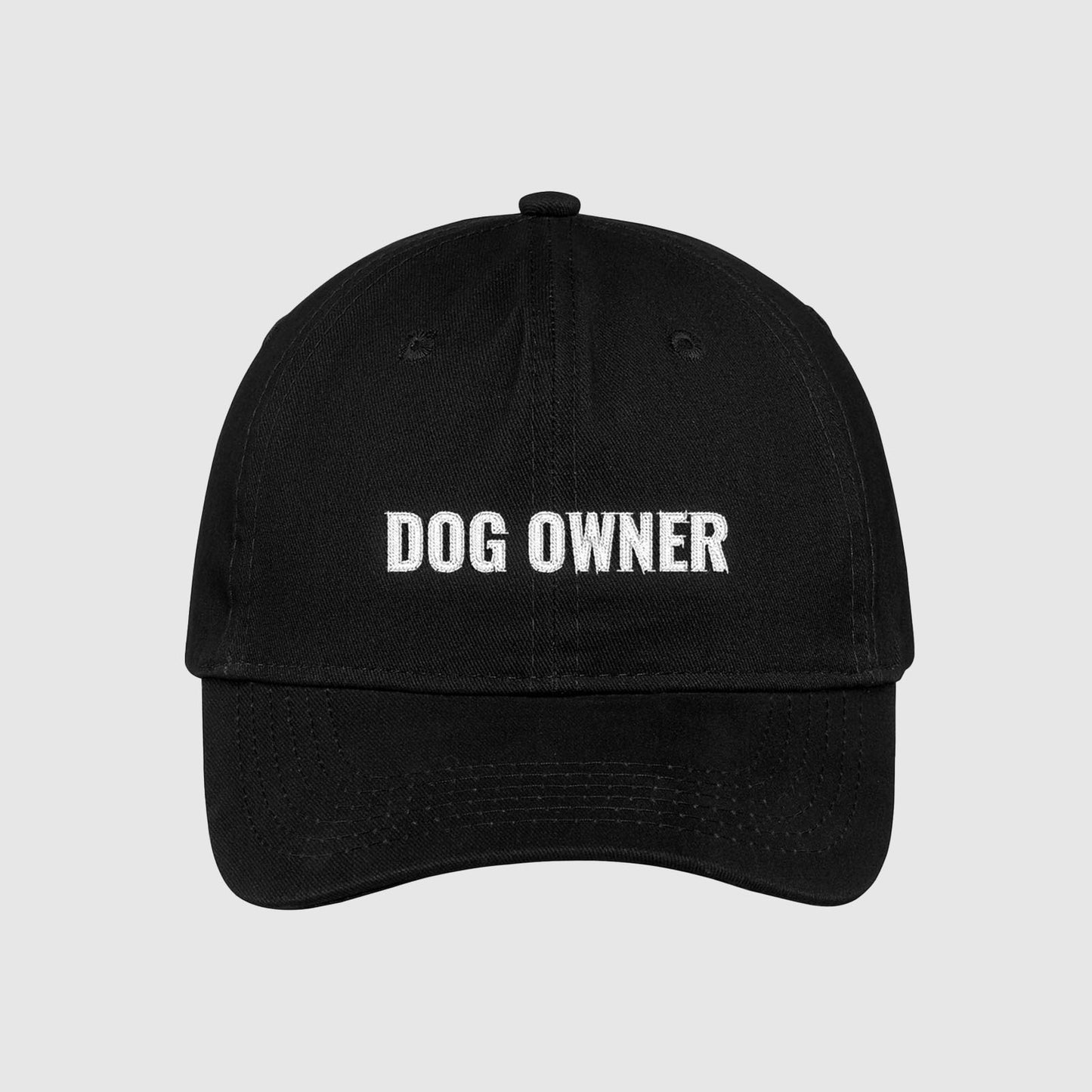 Black dad hat with Dog Owner embroidered on the front with white thread.