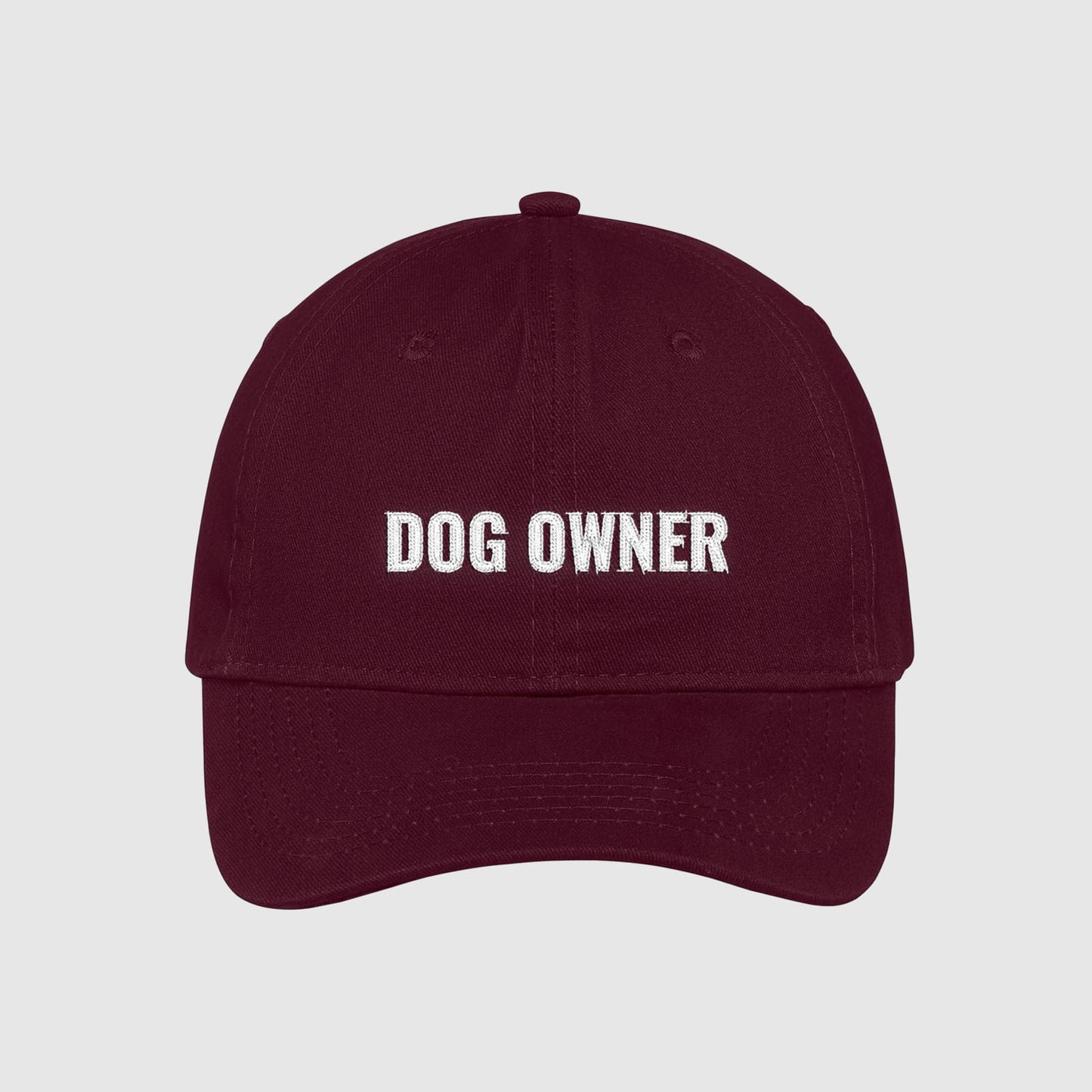 Maroon dad hat with Dog Owner embroidered on the front with white thread.