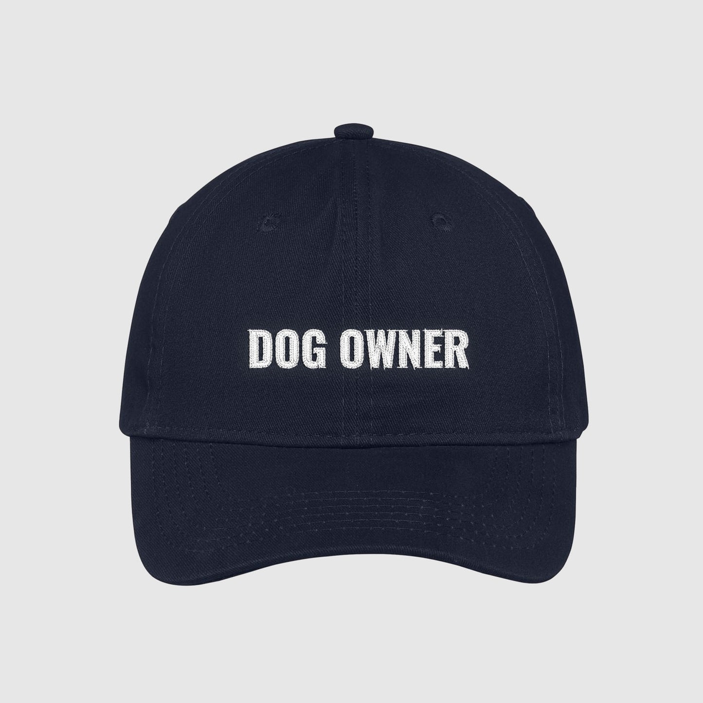 Navy dad hat with Dog Owner embroidered on the front with white thread.