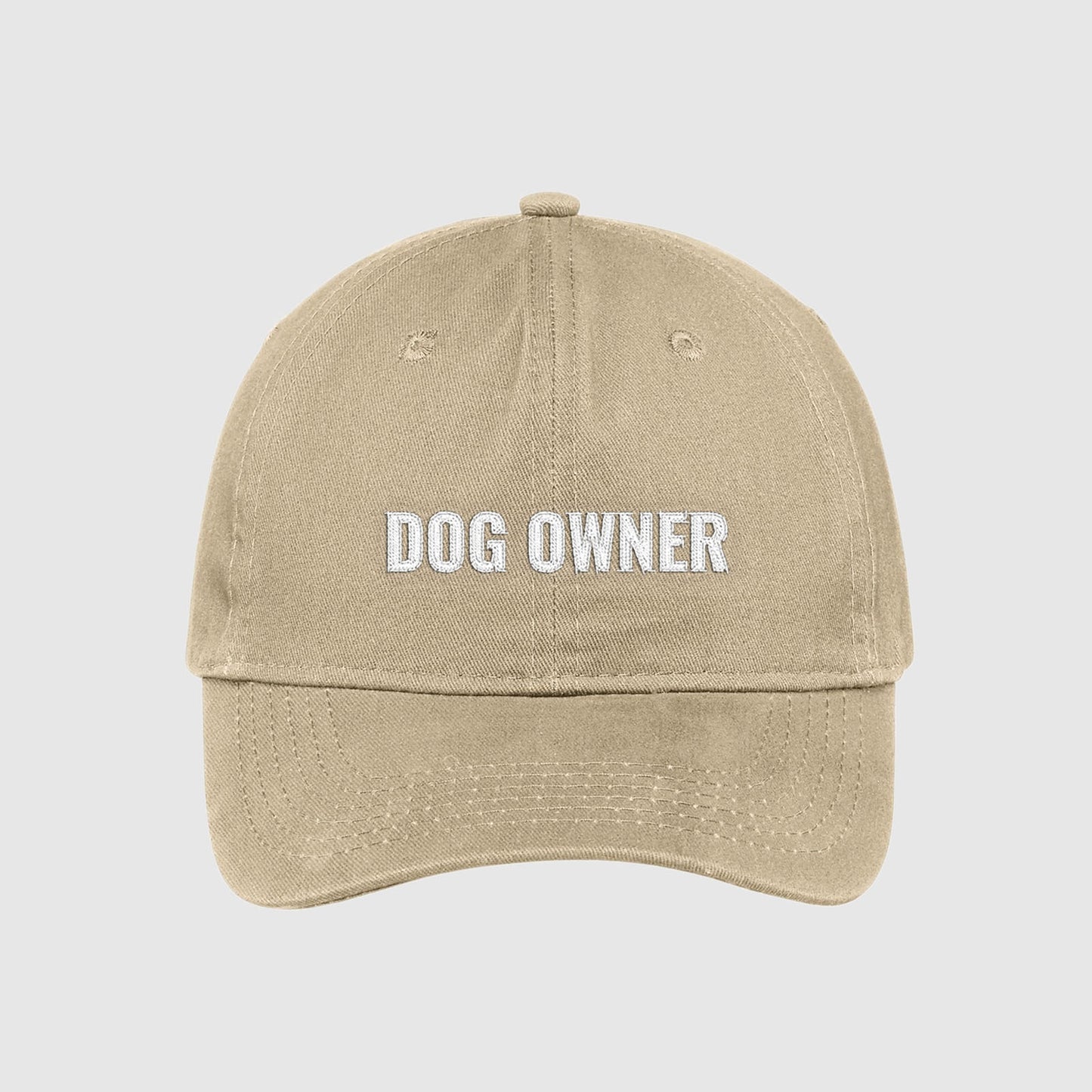 Khaki dad hat with Dog Owner embroidered on the front with white thread.